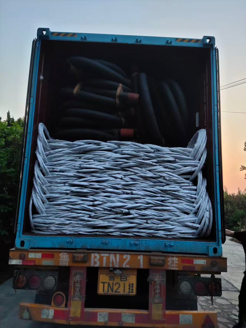 Steel cable and rubber hose loaded in a shipping container